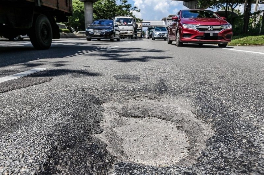 The potholes appeared in the middle of the road