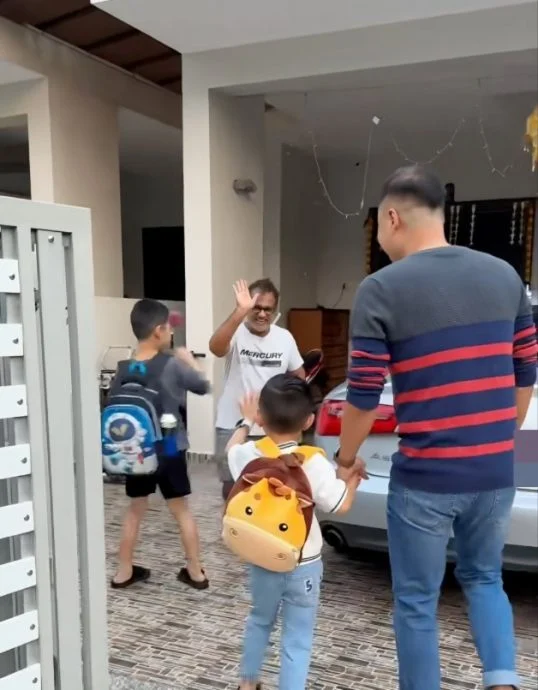 Indian neighbor, Sam helps a Chinese couple to drop their children off at day-care center.