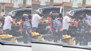 Generous fruit seller shares free watermelon slices with schoolchildren
