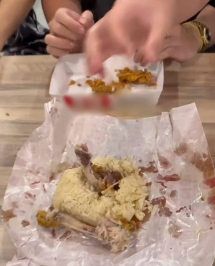 Packing chicken bones with rice. 