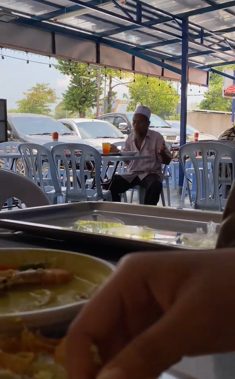 An elderly man was eating alone at a local restaurant