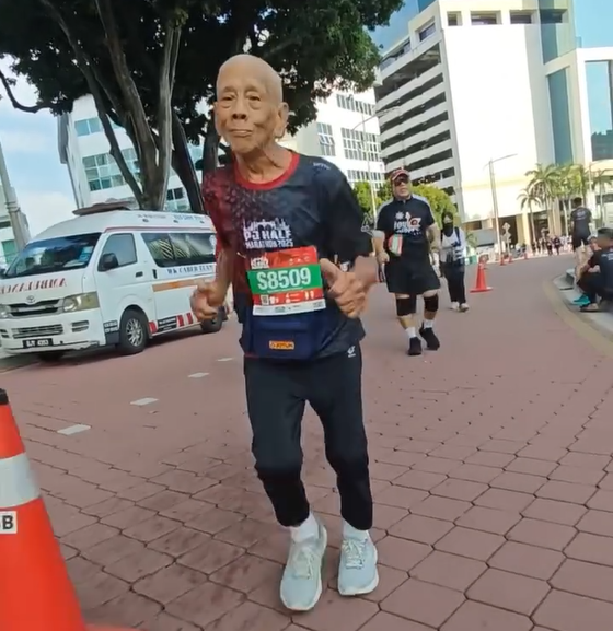 Ong keeps his pace steady and strong during marathon run, proving that age is no barrier to determination