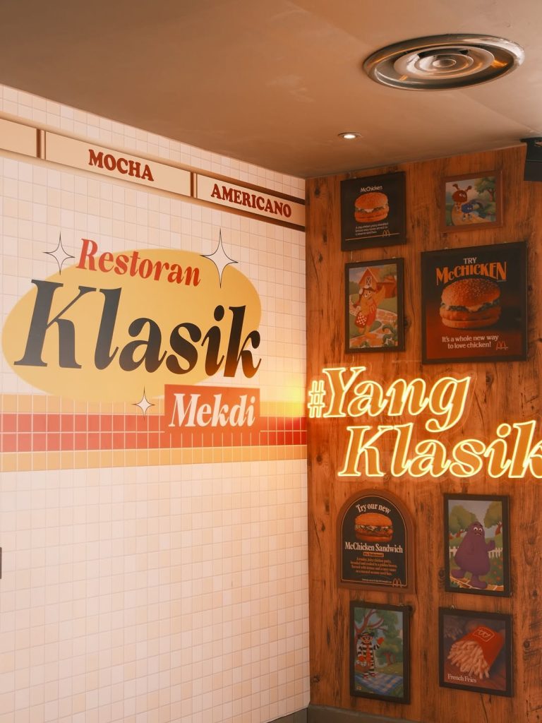 A retro-themed McDonald’s corner with “Restoran Klasik Mekdi” wall art, vintage McChicken posters