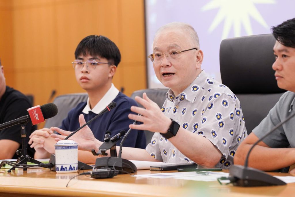 Dr Wee voicing concern over the “unfair admission system” at a press conference