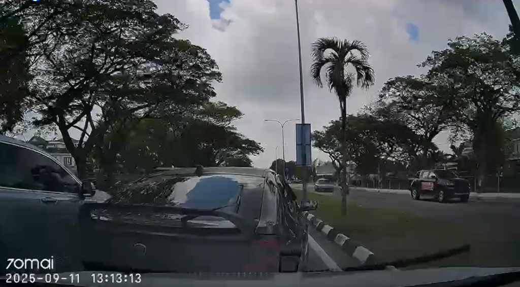 The Proton Gen2 suddenly reversed and hit their car in Selangor