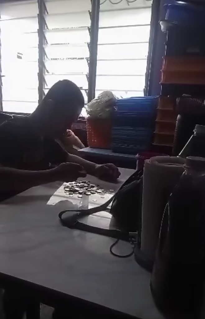 A father with disabilities (OKU) and a cancer patient, counting coins to buy milk and diapers for their young child