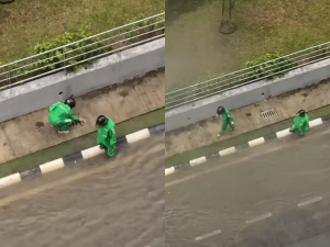 KL Grab riders help ease flooding by clearing drain during rainstorm