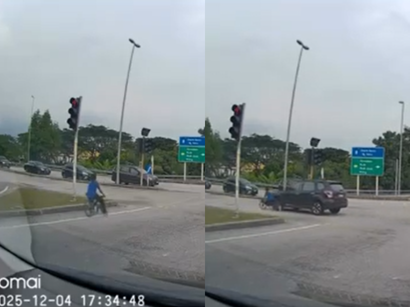 A child on a modified "basikal lajak" narrowly avoided danger after running a red light