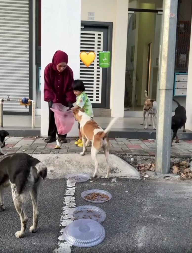 Airis and her son help clean up by collecting the used packaging and food scraps