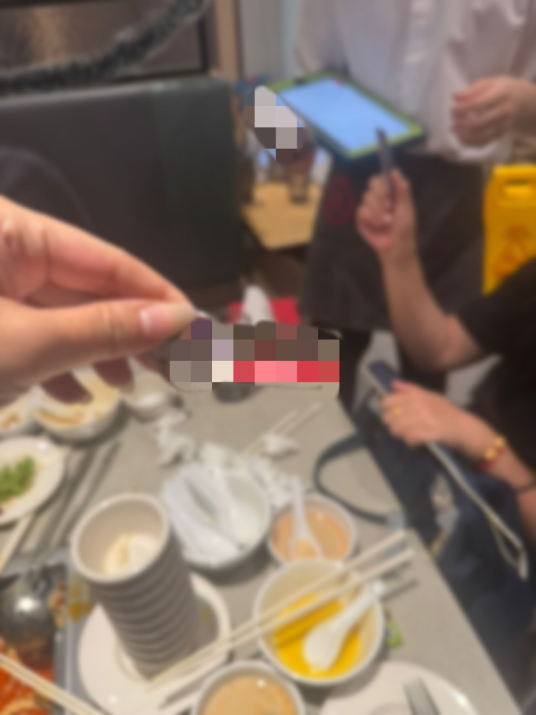 She claimed that staff laugher about her photographing name tags to submit feedback