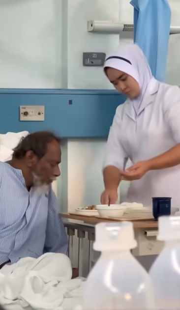 Nurse feeding a patient with care. 