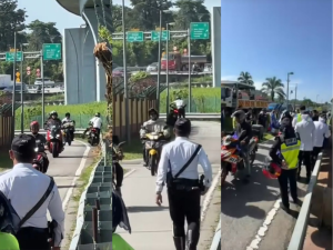 Motorcyclist hilariously falls off bike while escaping "road block", but it's actually Raya goodies